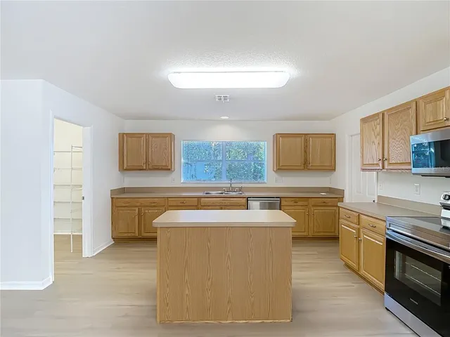a white bath tub sitting next to a window