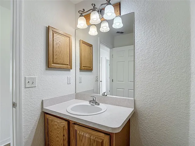 a bathroom with a shower a toilet and a shower