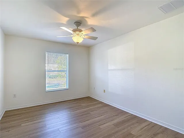 a front view of a house with a big yard