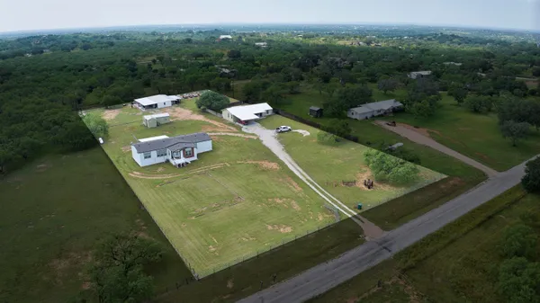 a view of a pool with a yard