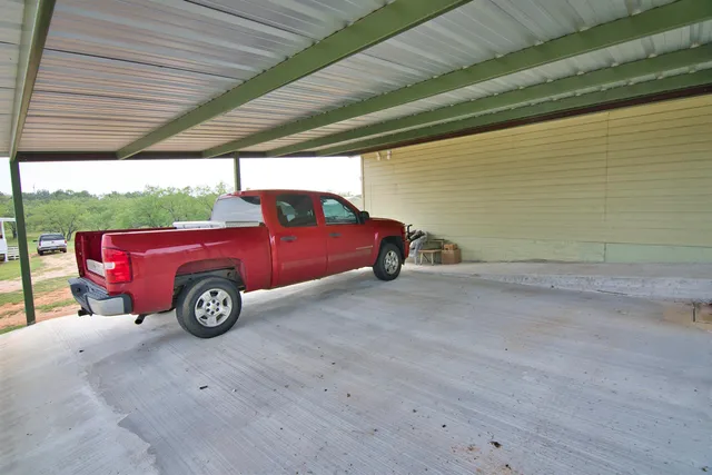 a view of a workspace with furniture and chandelier
