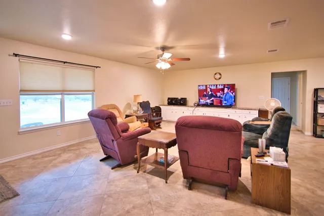 a kitchen with refrigerator cabinets and wooden floor
