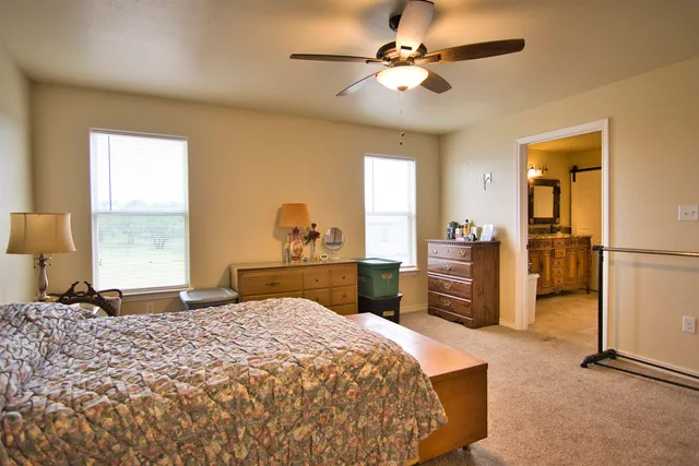 a view of a patio with a table chairs and a backyard