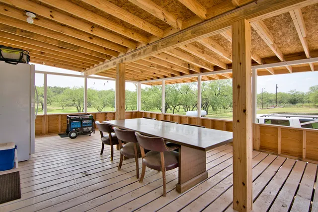 a outdoor space with wooden floor and outdoor seating