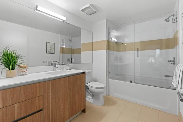 a bathroom with a sink toilet and shower