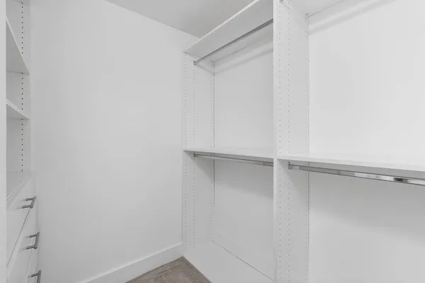 a view of an empty walk in closet
