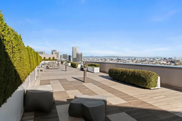 a view of roof deck with patio