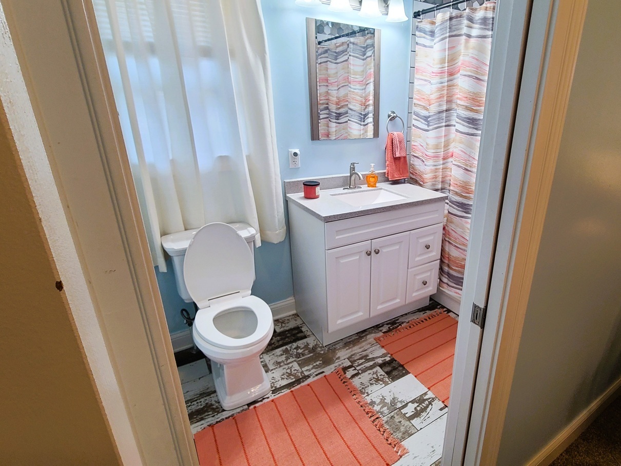405 North Center Street Plano, IL 60545 - Photo 13 of 35 a bathroom with a sink and a mirror