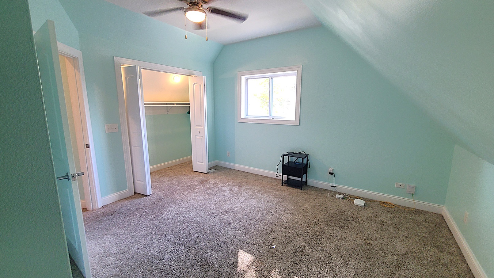405 North Center Street Plano, IL 60545 - Photo 18 of 35 an empty room with windows and fan