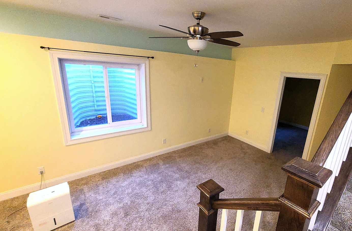 405 North Center Street Plano, IL 60545 - Photo 23 of 35 a view of an empty room with a window