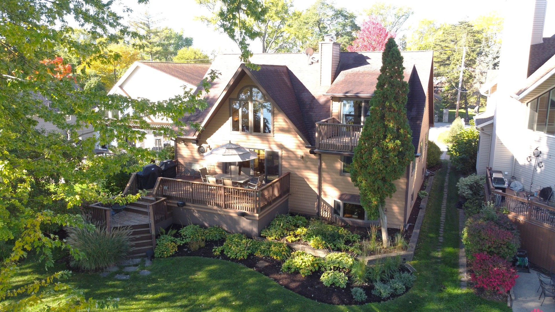 37131 North Stanton Point Road Ingleside, IL 60041 - Photo 21 of 28 a view of a house with a yard and garden