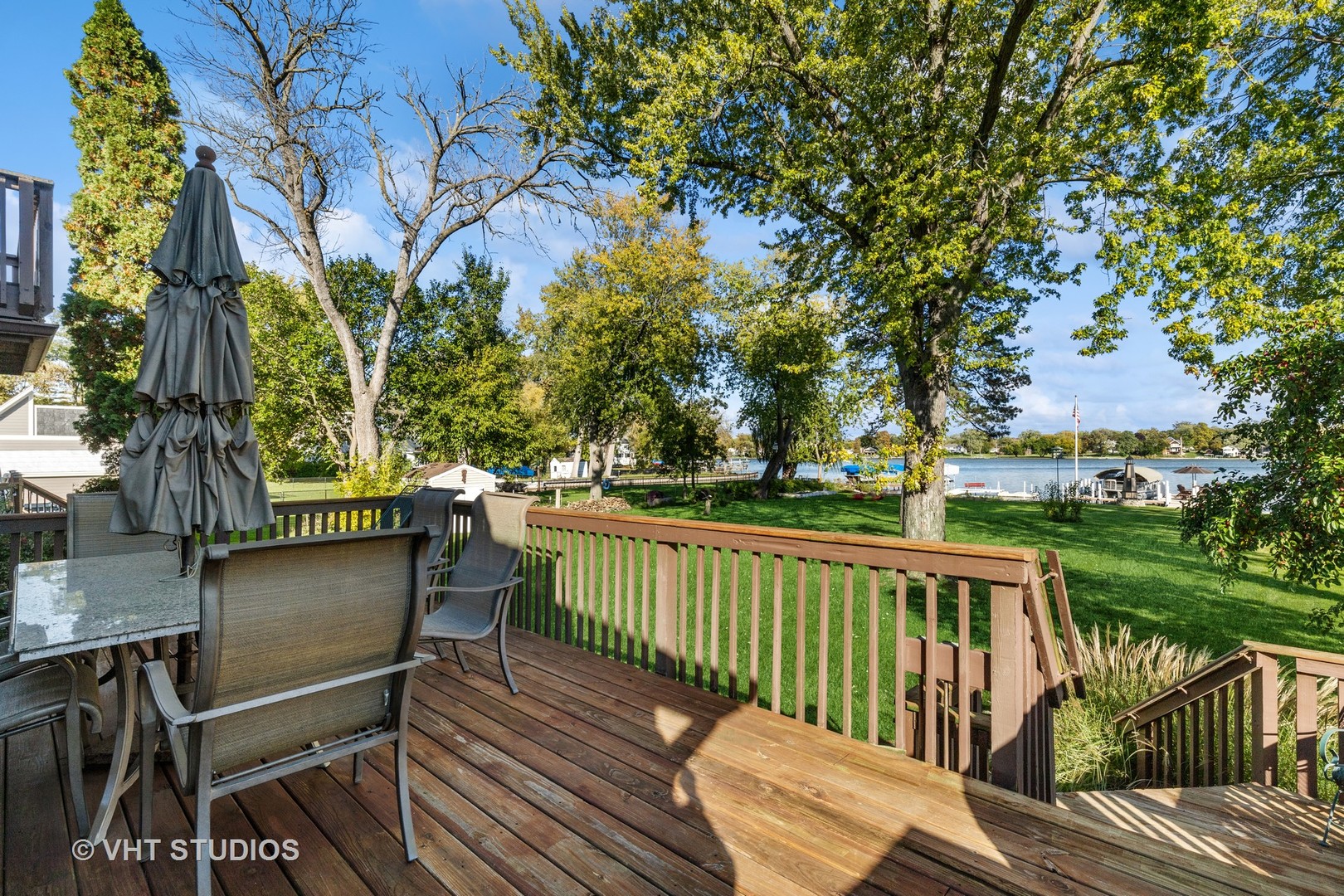 37131 North Stanton Point Road Ingleside, IL 60041 - Photo 23 of 28 a view of a wooden deck with chairs