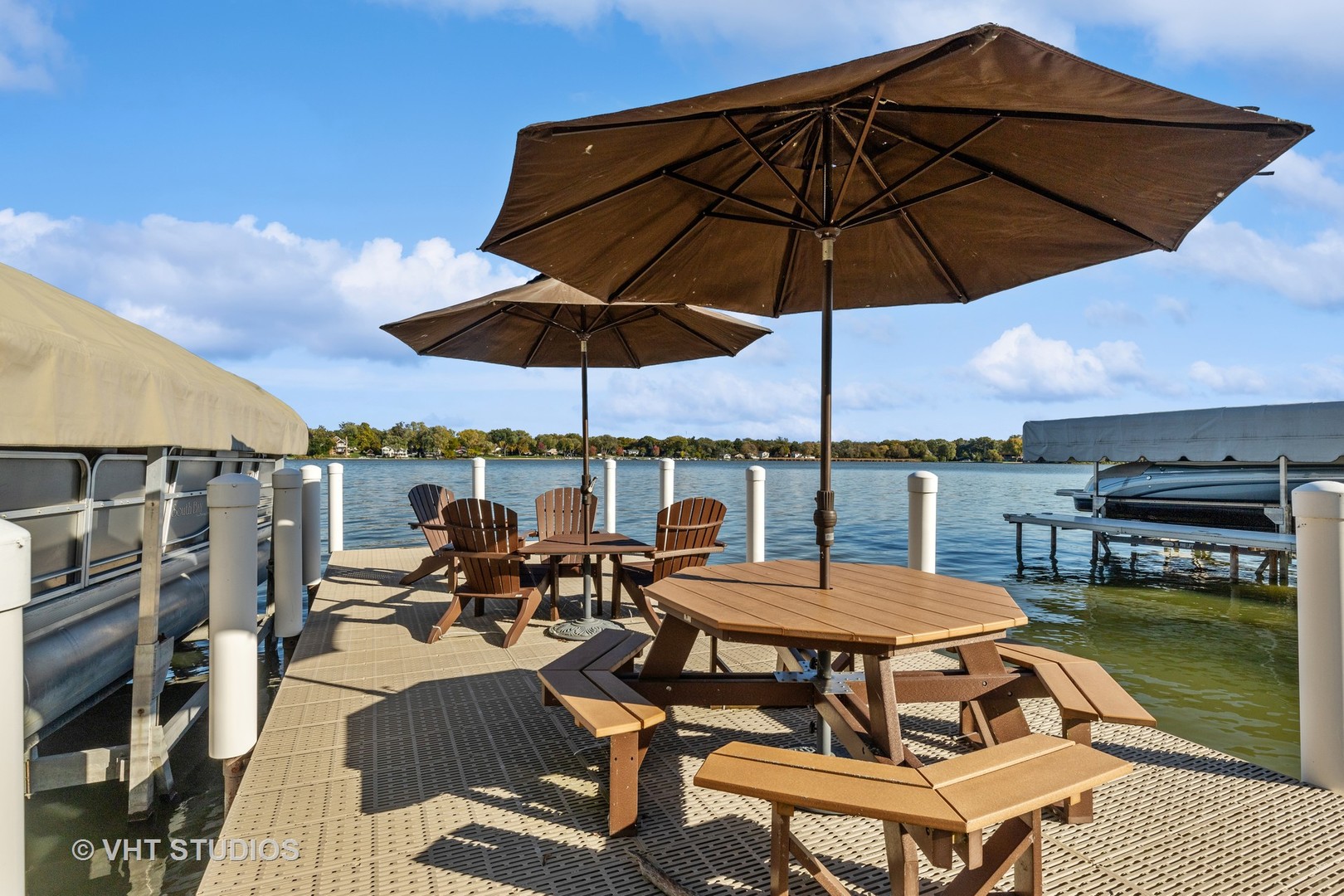 37131 North Stanton Point Road Ingleside, IL 60041 - Photo 24 of 28 an outdoor space with patio the table and chairs under an umbrella