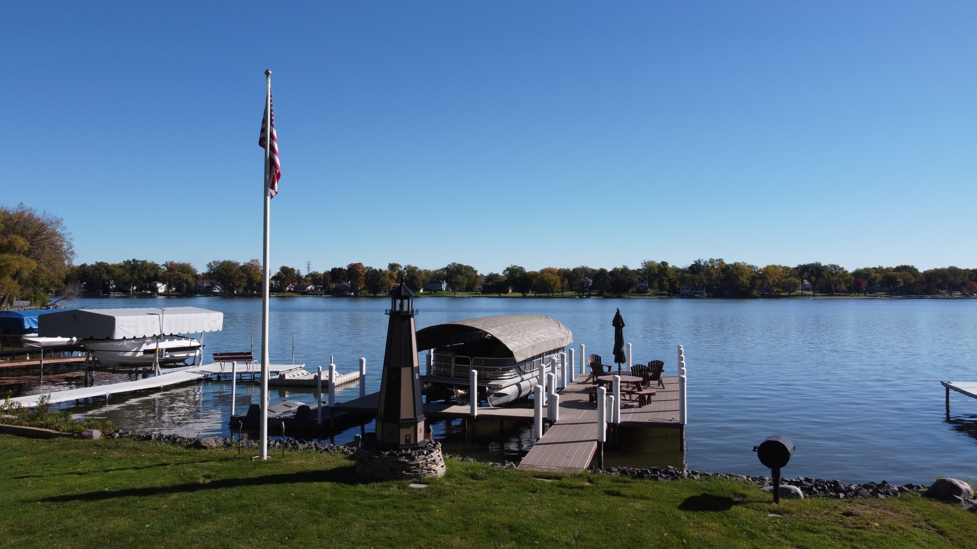 37131 North Stanton Point Road Ingleside, IL 60041 - Photo 28 of 28 a view of a lake with a garden and houses