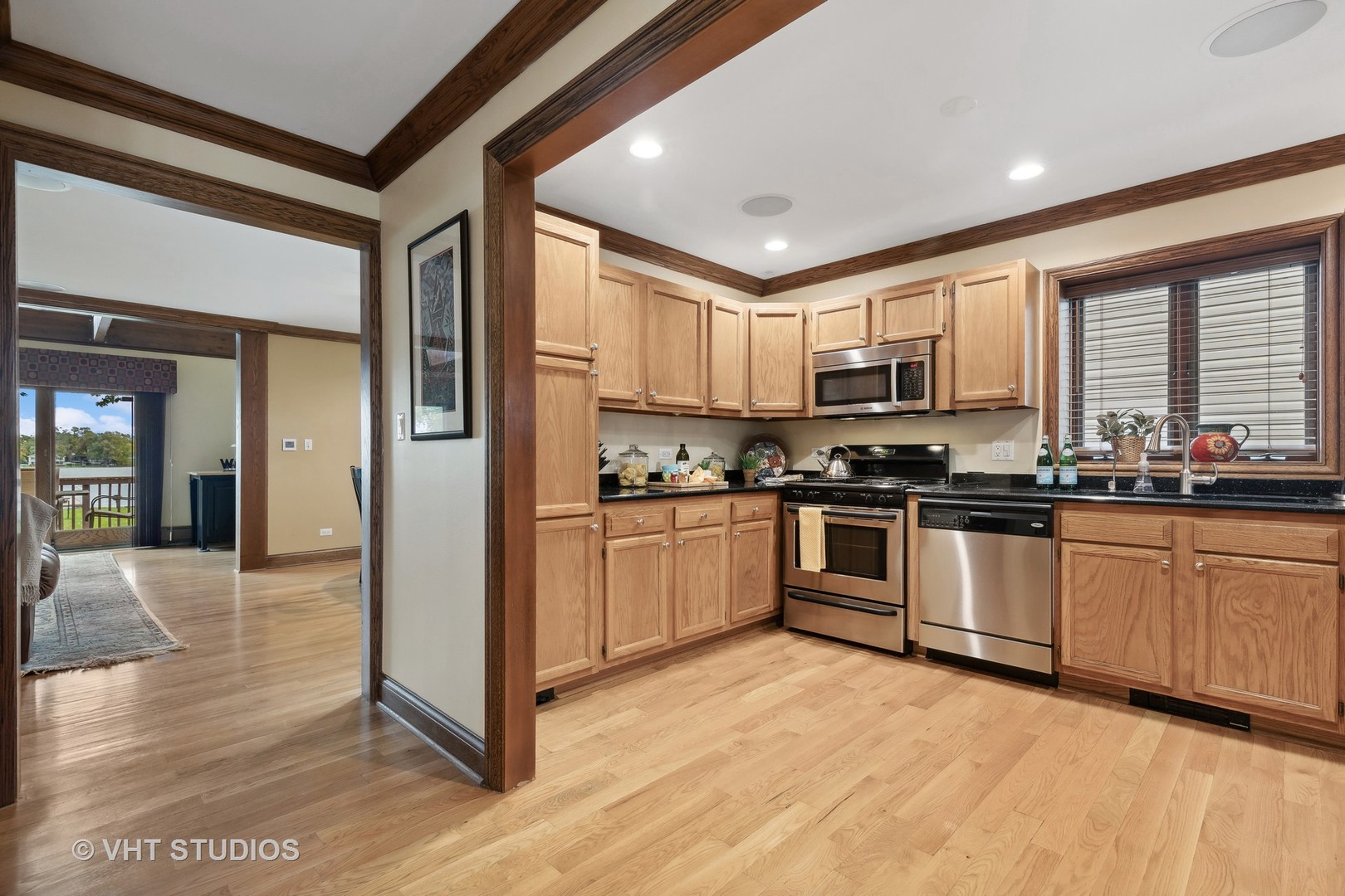 37131 North Stanton Point Road Ingleside, IL 60041 - Photo 4 of 28 a kitchen with stainless steel appliances granite countertop a refrigerator and a stove top oven