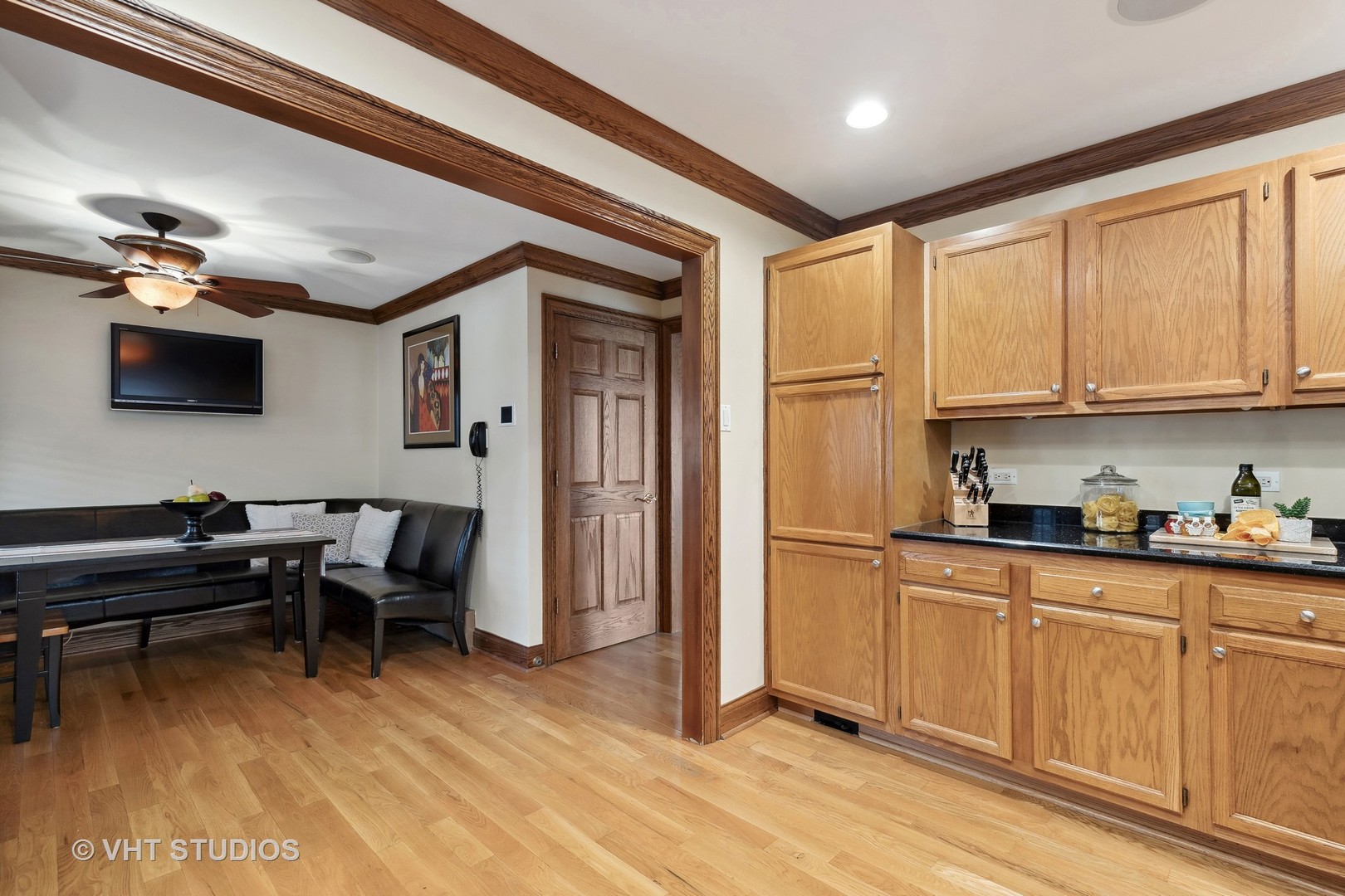 37131 North Stanton Point Road Ingleside, IL 60041 - Photo 6 of 28 a kitchen with stainless steel appliances granite countertop a stove top oven a sink dishwasher and a dining table with wooden floor