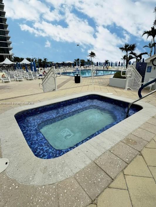 2030 South Ocean Drive, Unit 725 Hallandale Beach, FL 33009 - Photo 19 of 21 a view of a swimming pool with a lake