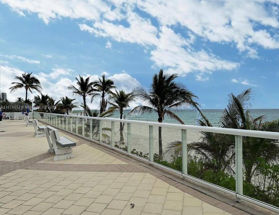 2030 South Ocean Drive, Unit 725 Hallandale Beach, FL 33009 - Photo 20 of 21 a view of a swimming pool with a table and chairs