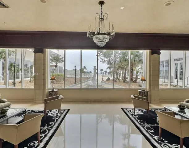 a kitchen with a stove a sink and a dining table