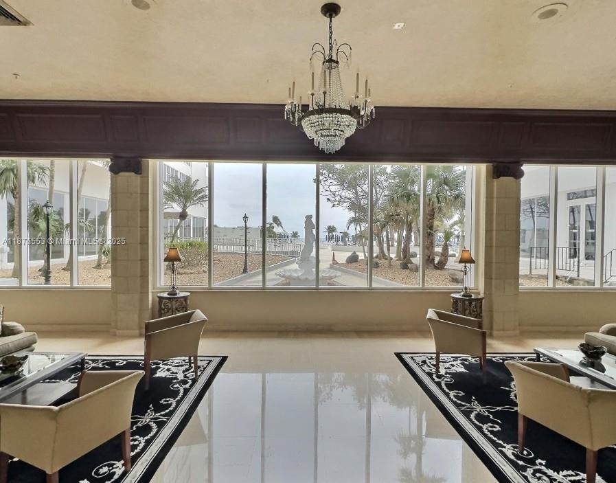 2030 South Ocean Drive, Unit 725 Hallandale Beach, FL 33009 - Photo 4 of 21 a kitchen with a stove a sink and a dining table