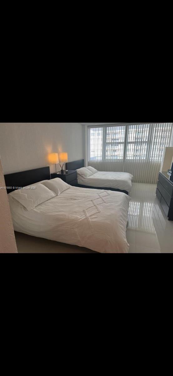 2030 South Ocean Drive, Unit 725 Hallandale Beach, FL 33009 - Photo 7 of 21 a view of a bedroom with furniture