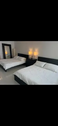 a view of wooden floor and a potted plant