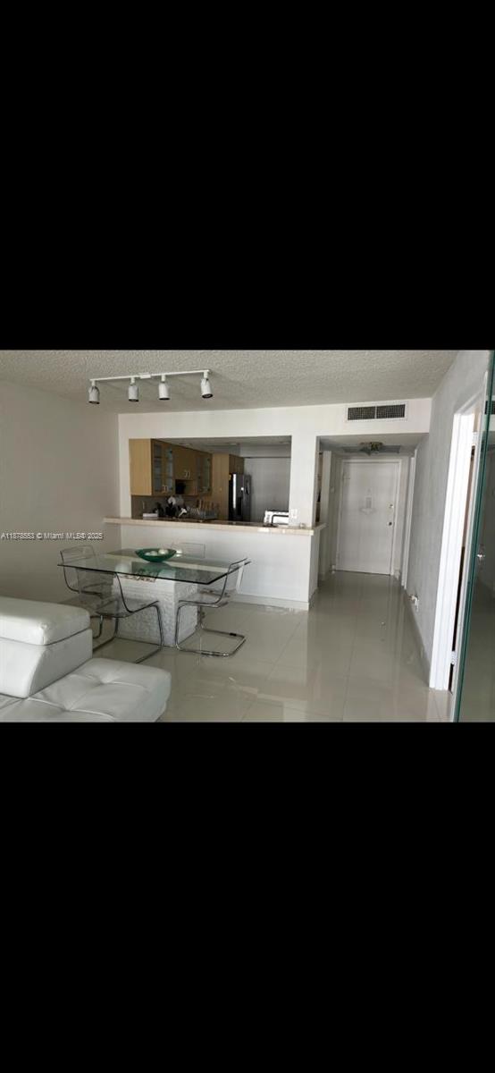 2030 South Ocean Drive, Unit 725 Hallandale Beach, FL 33009 - Photo 9 of 21 a kitchen with stainless steel appliances a sink and a microwave