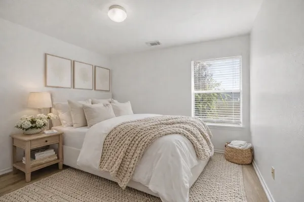 a kitchen with stainless steel appliances kitchen island granite countertop a sink and a white cabinets