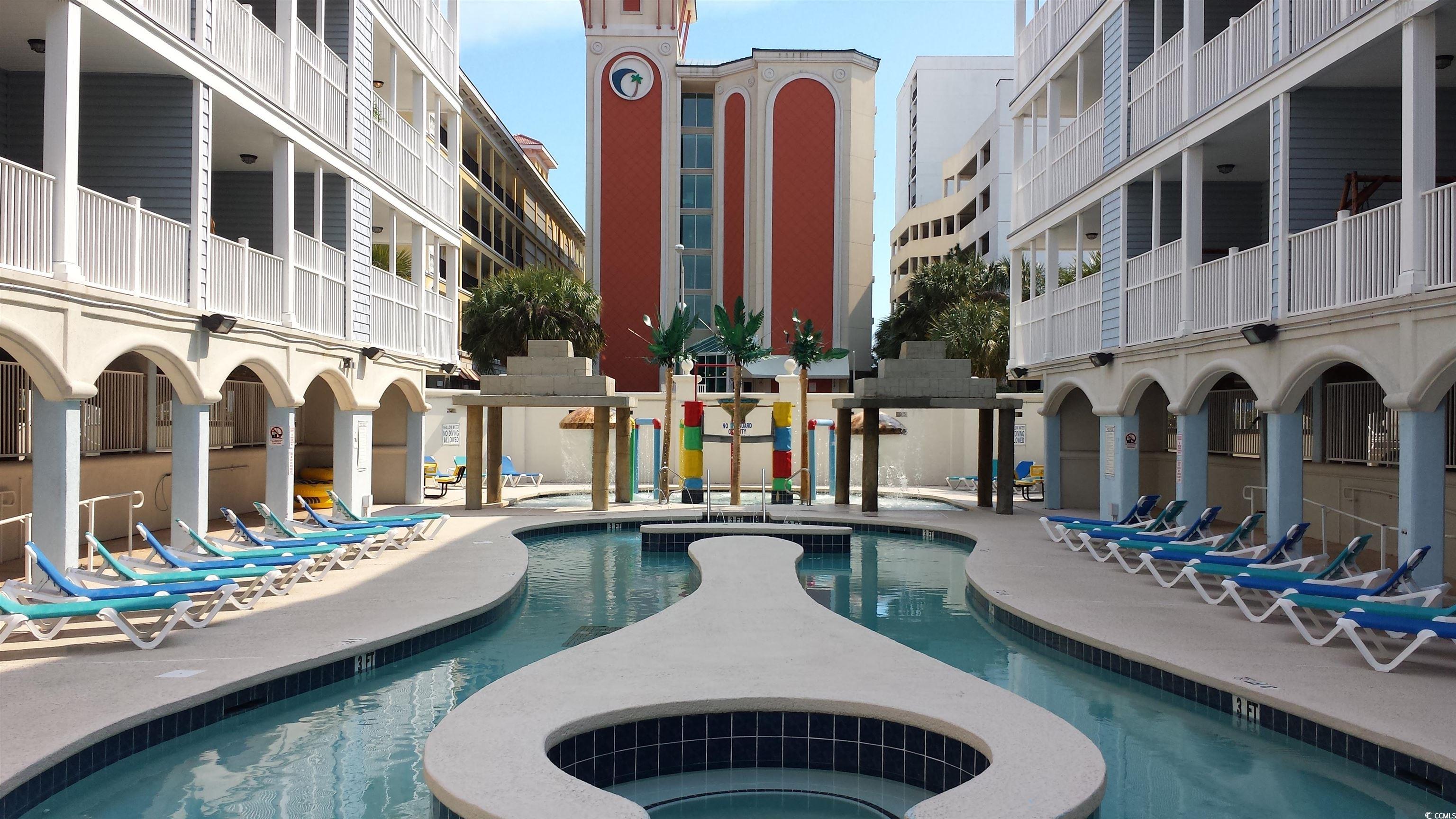 Community pool with a patio area