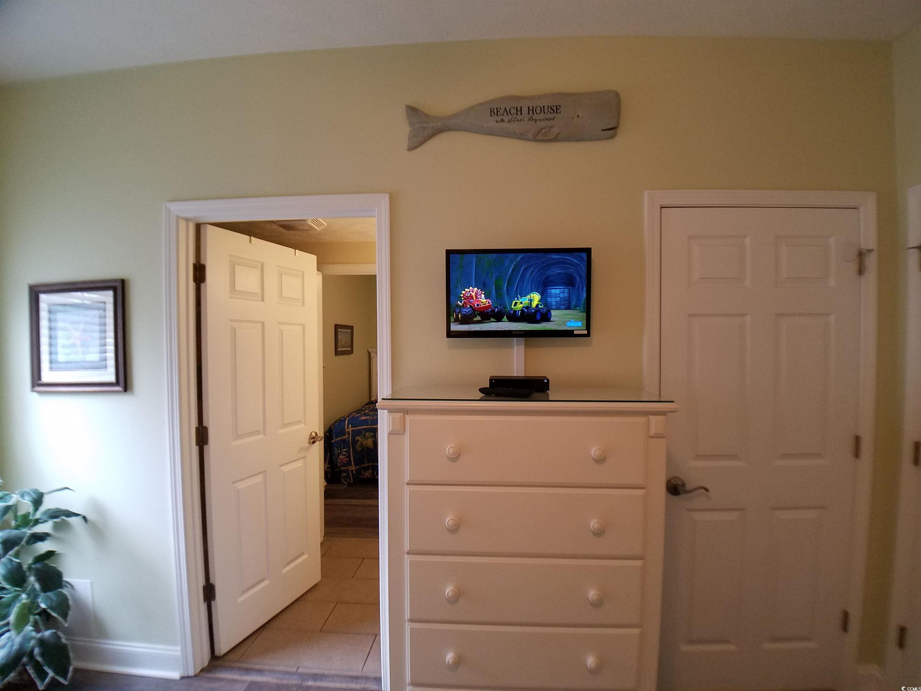 704 South Ocean Boulevard, Unit 101B Myrtle Beach, SC 29577 - Photo 20 of 25 Bedroom with baseboards and light tile patterned flooring
