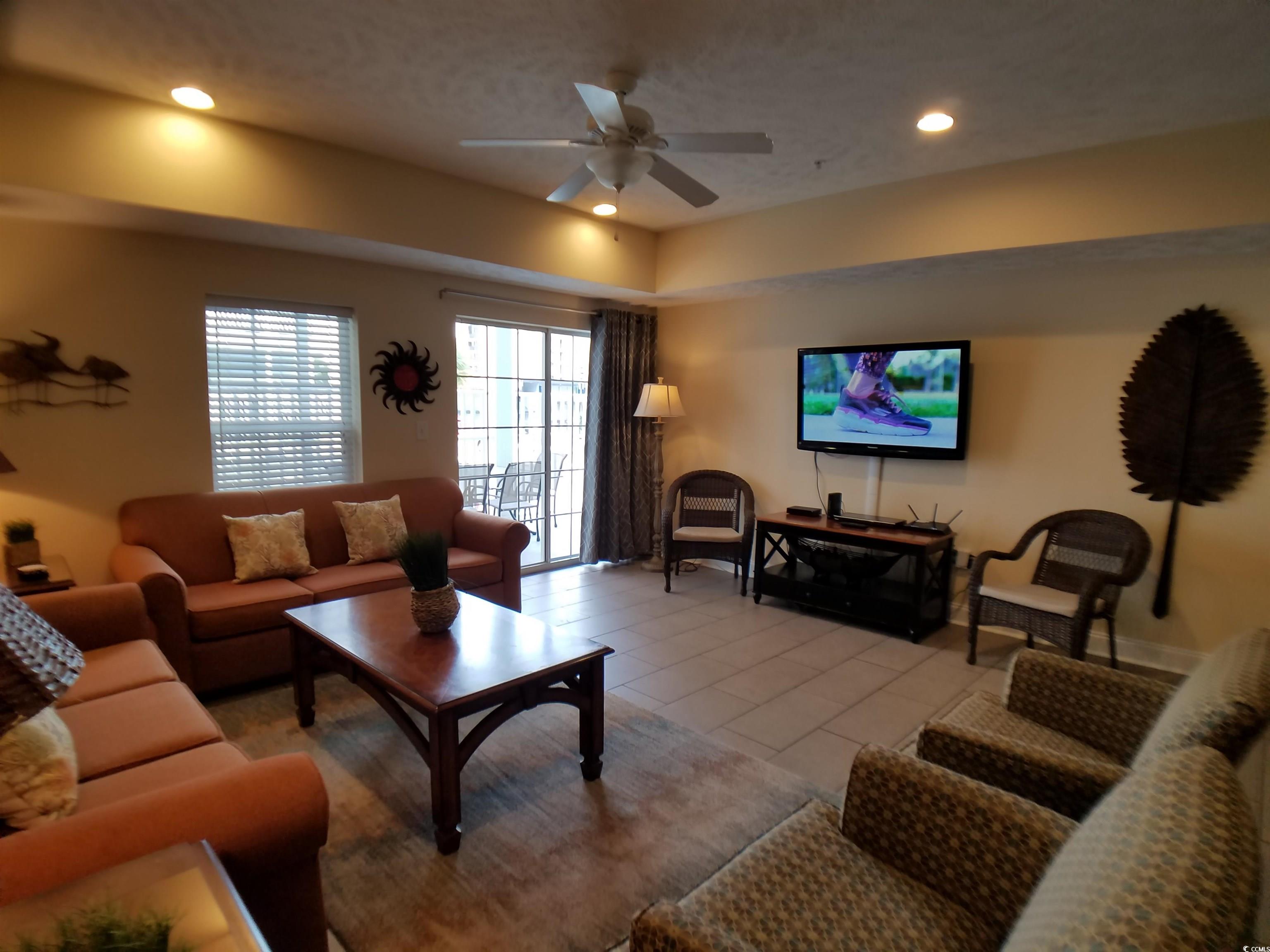 704 South Ocean Boulevard, Unit 101B Myrtle Beach, SC 29577 - Photo 3 of 25 Living area with ceiling fan and recessed lighting
