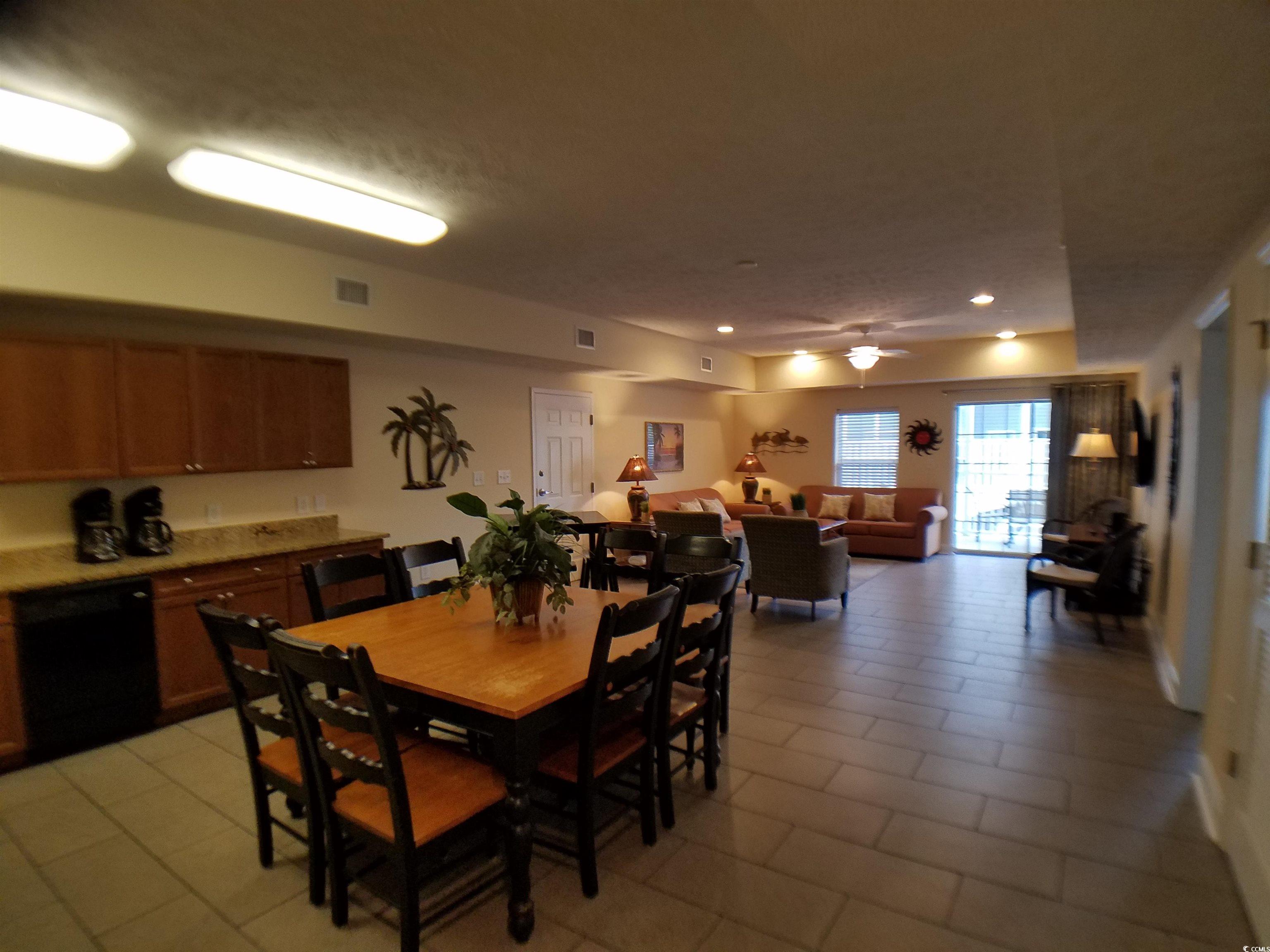 704 South Ocean Boulevard, Unit 101B Myrtle Beach, SC 29577 - Photo 6 of 25 Dining room featuring recessed lighting, light tile patterned floors, and a ceiling fan