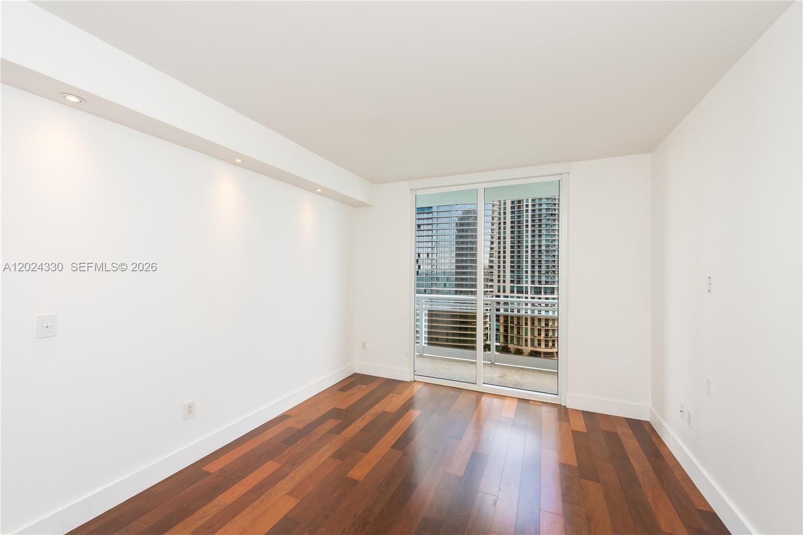 901 Brickell Key Boulevard, Unit 2006 Miami, FL 33131 - Photo 29 of 41 Bedroom 3 -Wood Floors - Recessed Lighting - Sliding Door