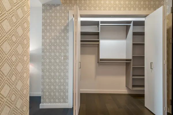 a kitchen with stainless steel appliances a stove a sink and a microwave