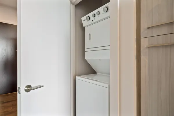 a living room with a couch and a stove top oven
