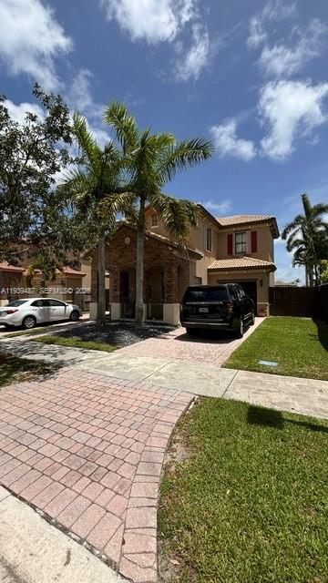 11382 Southwest 242nd Street Homestead, FL 33032 - Photo 2 of 21 a view of a house with a yard