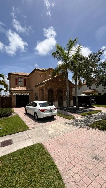 11382 Southwest 242nd Street Homestead, FL 33032 - Photo 3 of 21 a view of a house with a yard and pathway