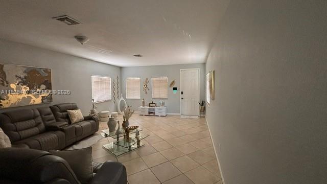 11382 Southwest 242nd Street Homestead, FL 33032 - Photo 4 of 21 a living room with furniture and a table