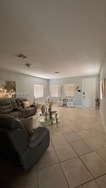 11382 Southwest 242nd Street Homestead, FL 33032 - Photo 5 of 21 a living room with furniture and a table