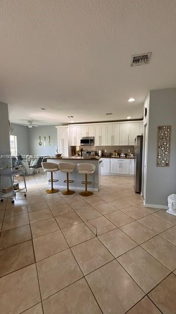 11382 Southwest 242nd Street Homestead, FL 33032 - Photo 7 of 21 a lobby with furniture and kitchen view