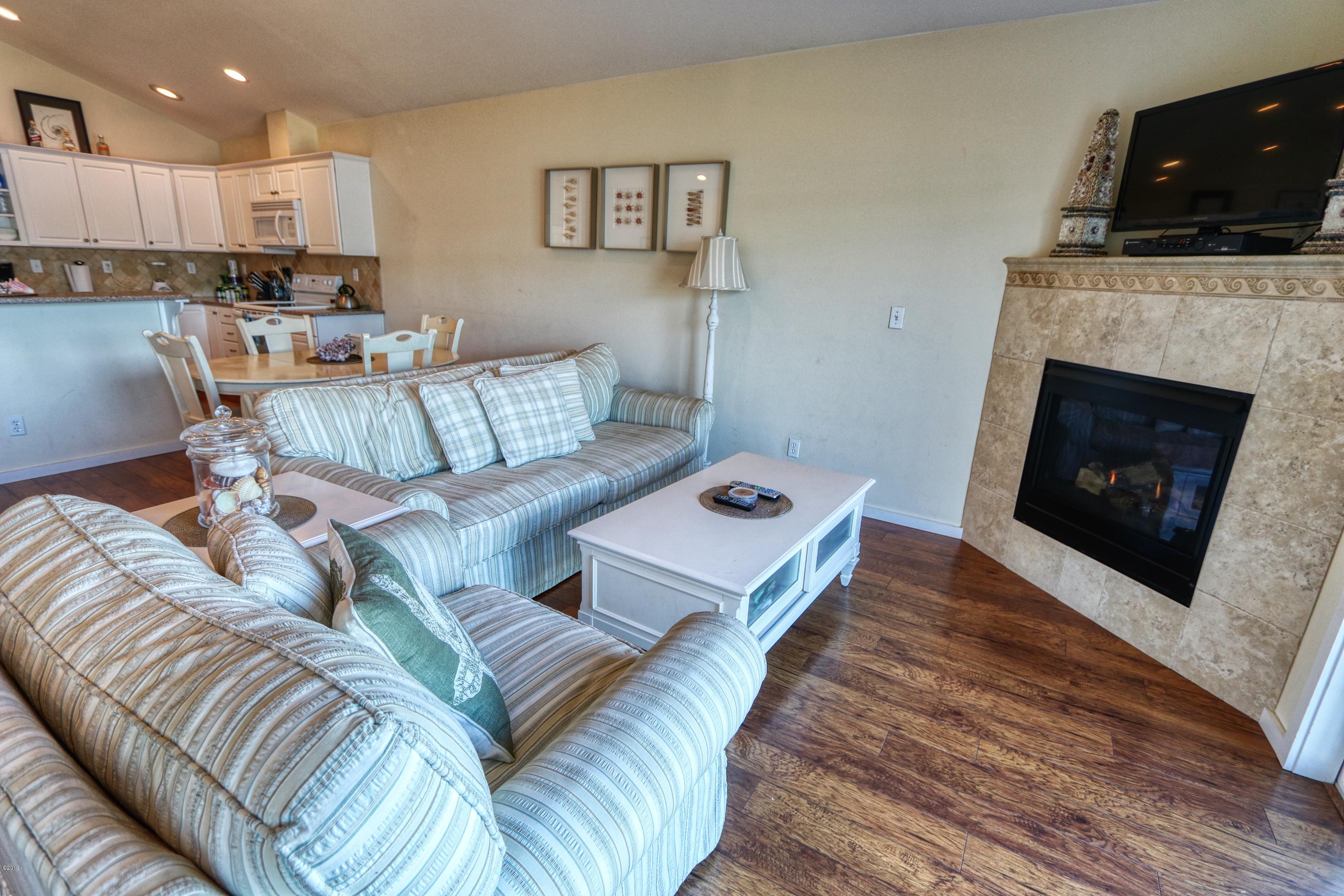 236 Southwest 27th Street South Beach, OR 97366 - Photo 11 of 25 Living Room Fireplace