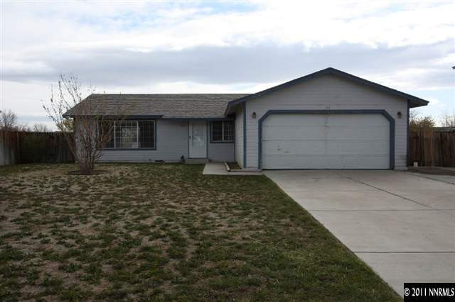 261 River Boat Road Dayton, NV 89403 - Photo 1 of 13 a front view of a house with a yard