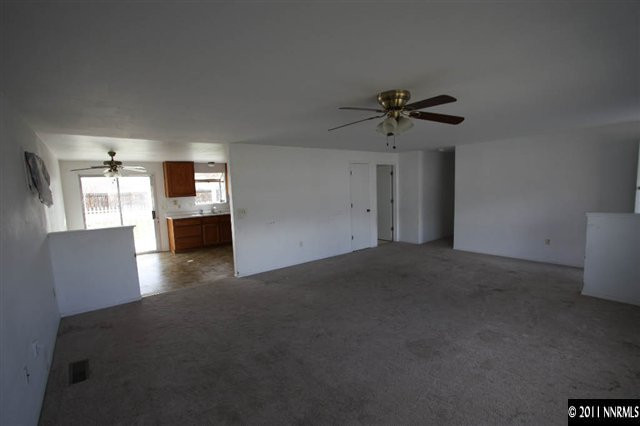 261 River Boat Road Dayton, NV 89403 - Photo 3 of 13 a view of empty room with a ceiling fan and window