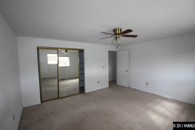 261 River Boat Road Dayton, NV 89403 - Photo 8 of 13 a view of an empty room with a ceiling fan