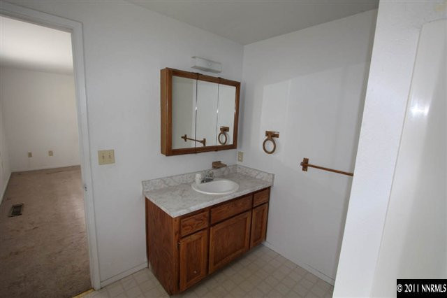 261 River Boat Road Dayton, NV 89403 - Photo 10 of 13 a bathroom with a sink and a mirror