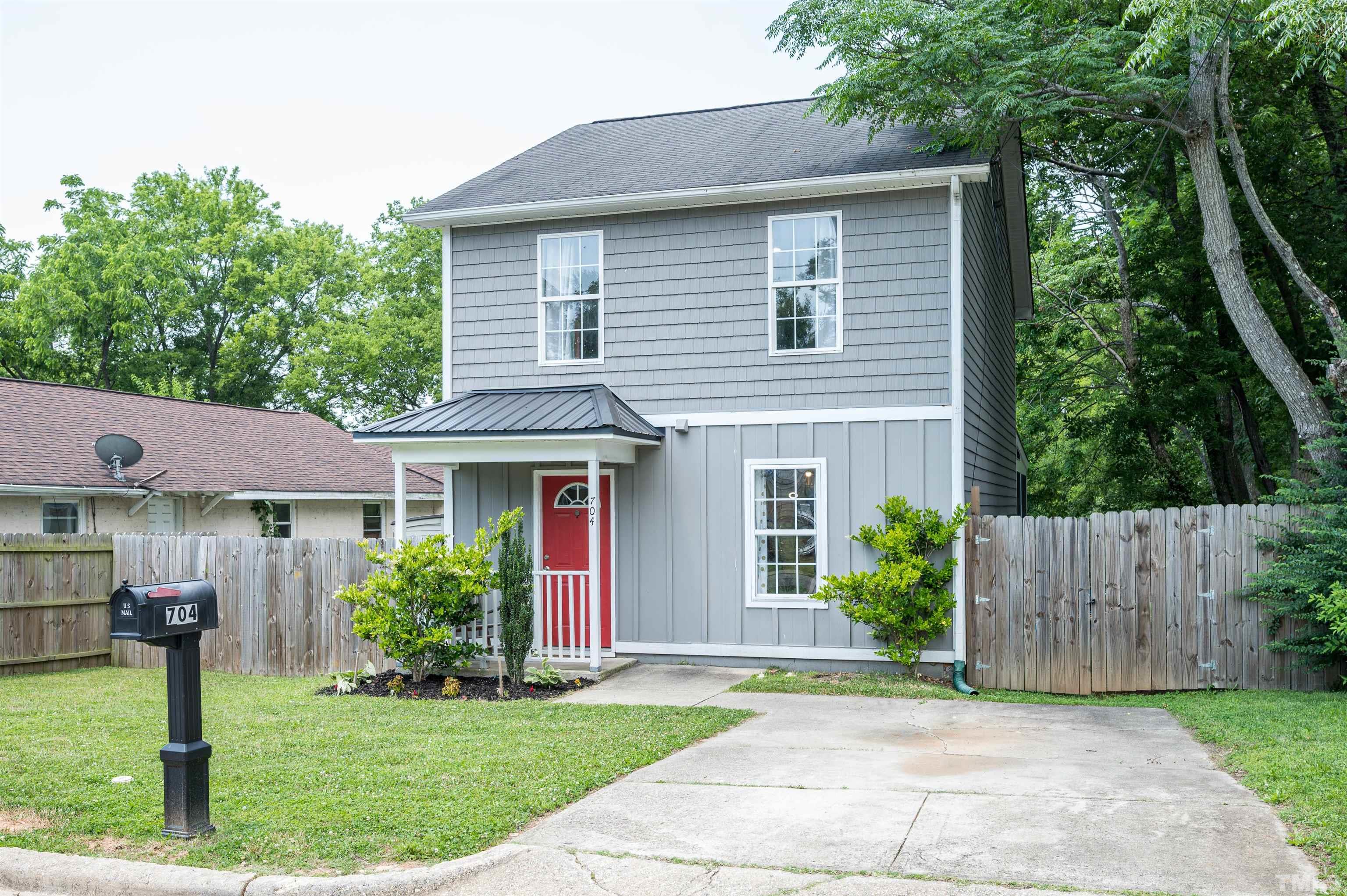 704 Quarry Street Raleigh, NC 27601 - Photo 3 of 27 a front view of a house with a yard and trees
