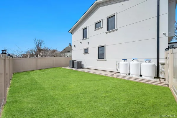 a view of a backyard with sitting area