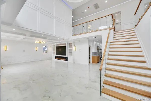 a view of staircase with white walls