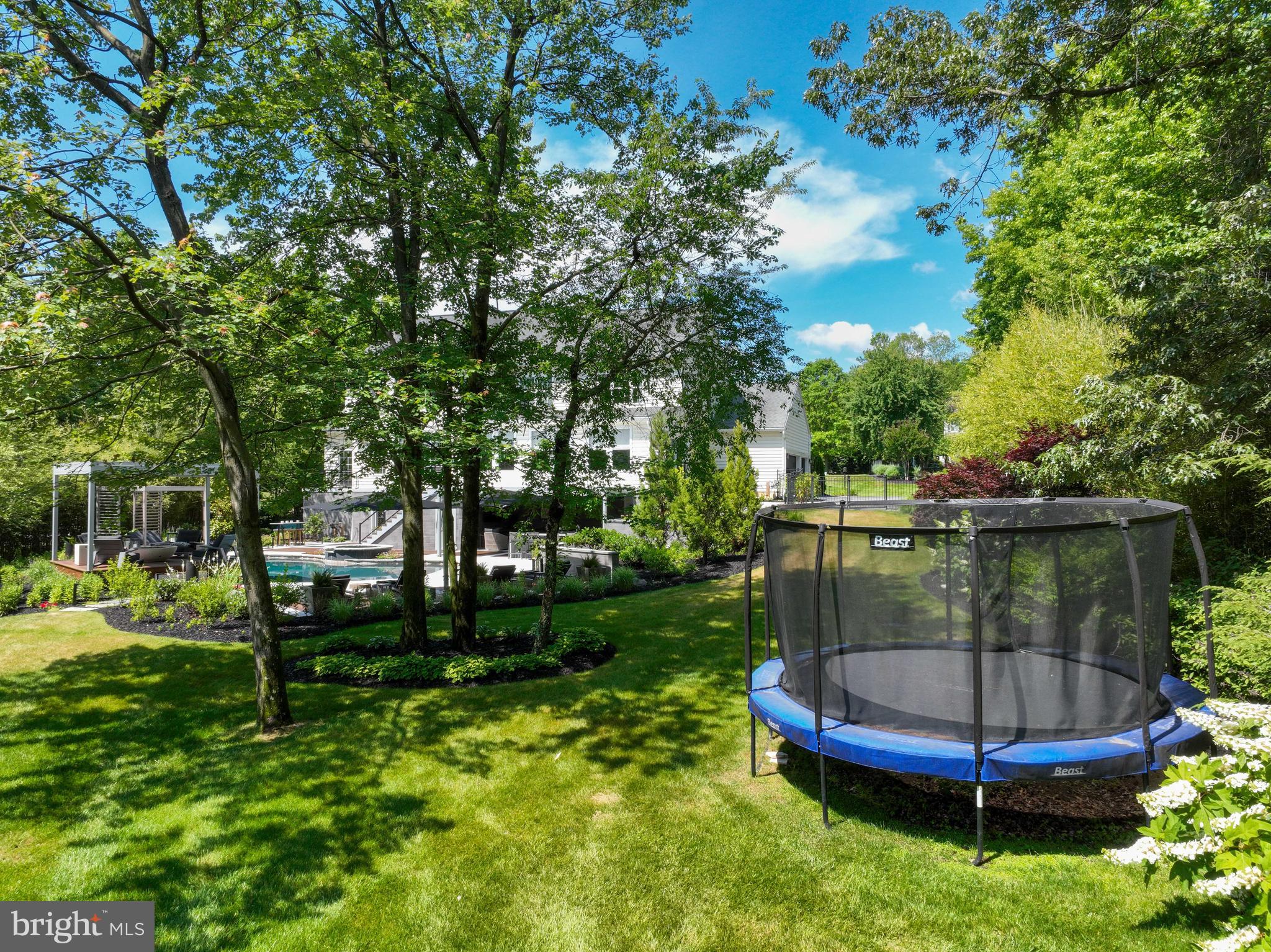 1613 Braid Hills Drive Pasadena, MD 21122 - Photo 104 of 148 a view of a backyard with plants and a garden