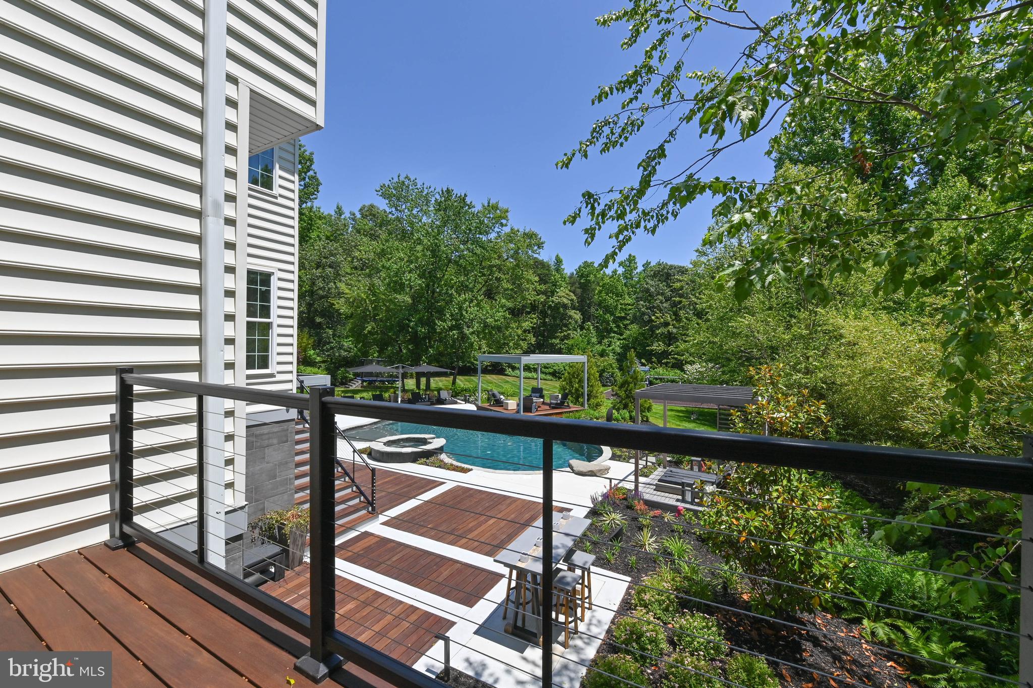 1613 Braid Hills Drive Pasadena, MD 21122 - Photo 125 of 148 a view of a balcony with floor to ceiling windows and wooden fence